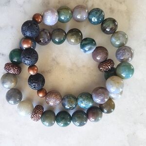 Pair of beaded bracelets with diffuser beads for essential oils or perfume